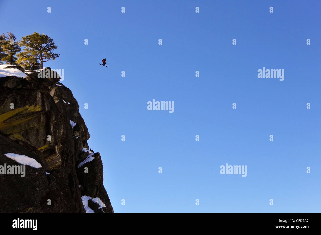Pro skier Josh Daiek performs a double backflip ski BASE jumping off of