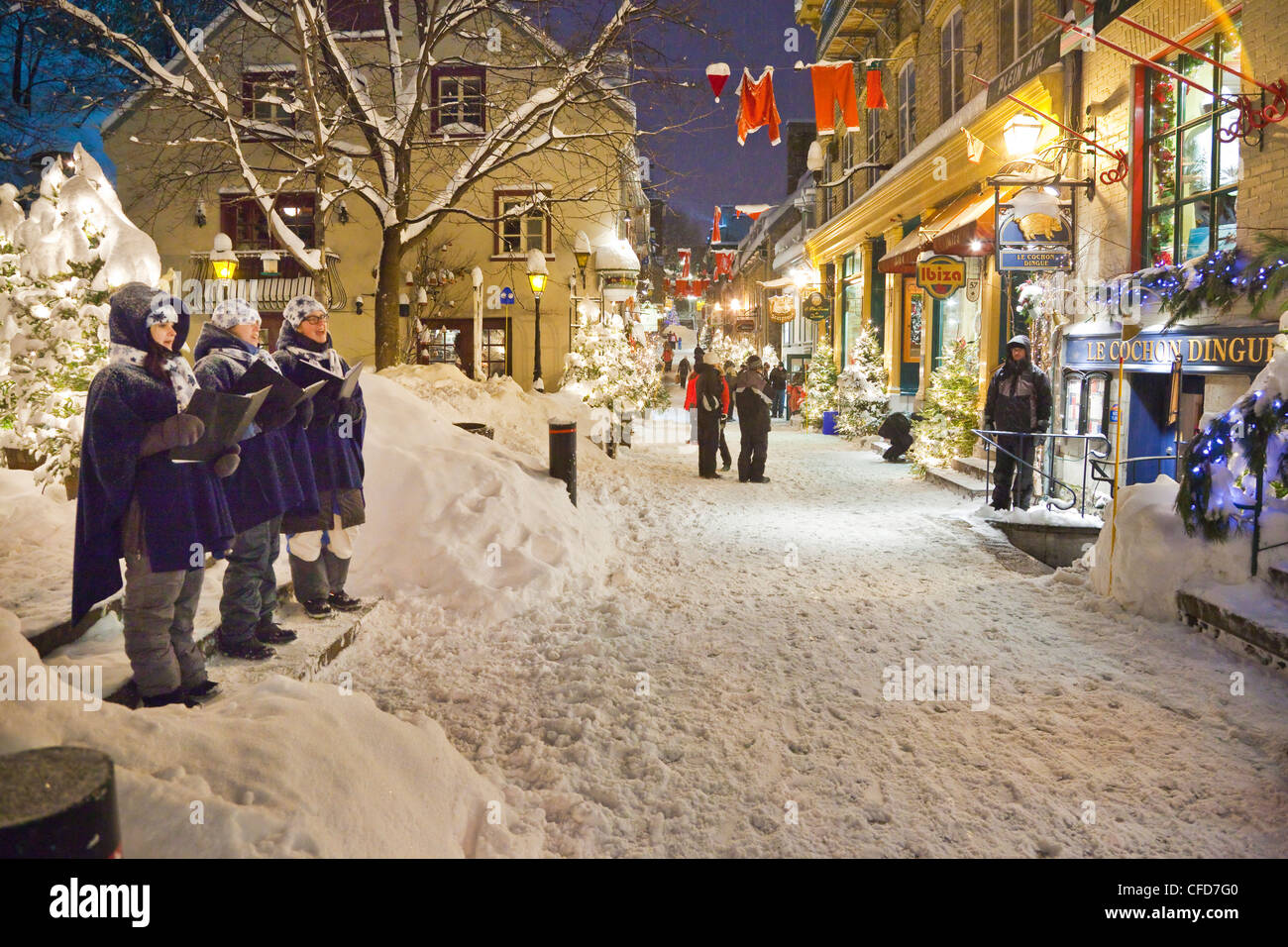 Christmas carollers adding festive winter Stock Photo