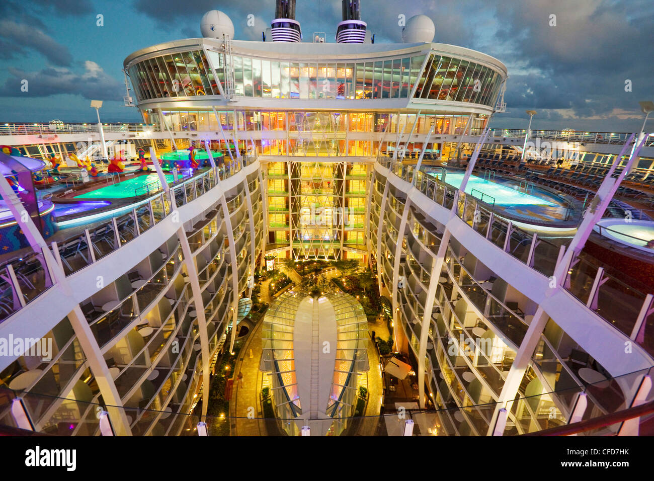 High angle nightime view of Central Park, one of seven 'neighborhoods' on board Royal Caribbean's Oasis of the Seas cruise ship. Stock Photo