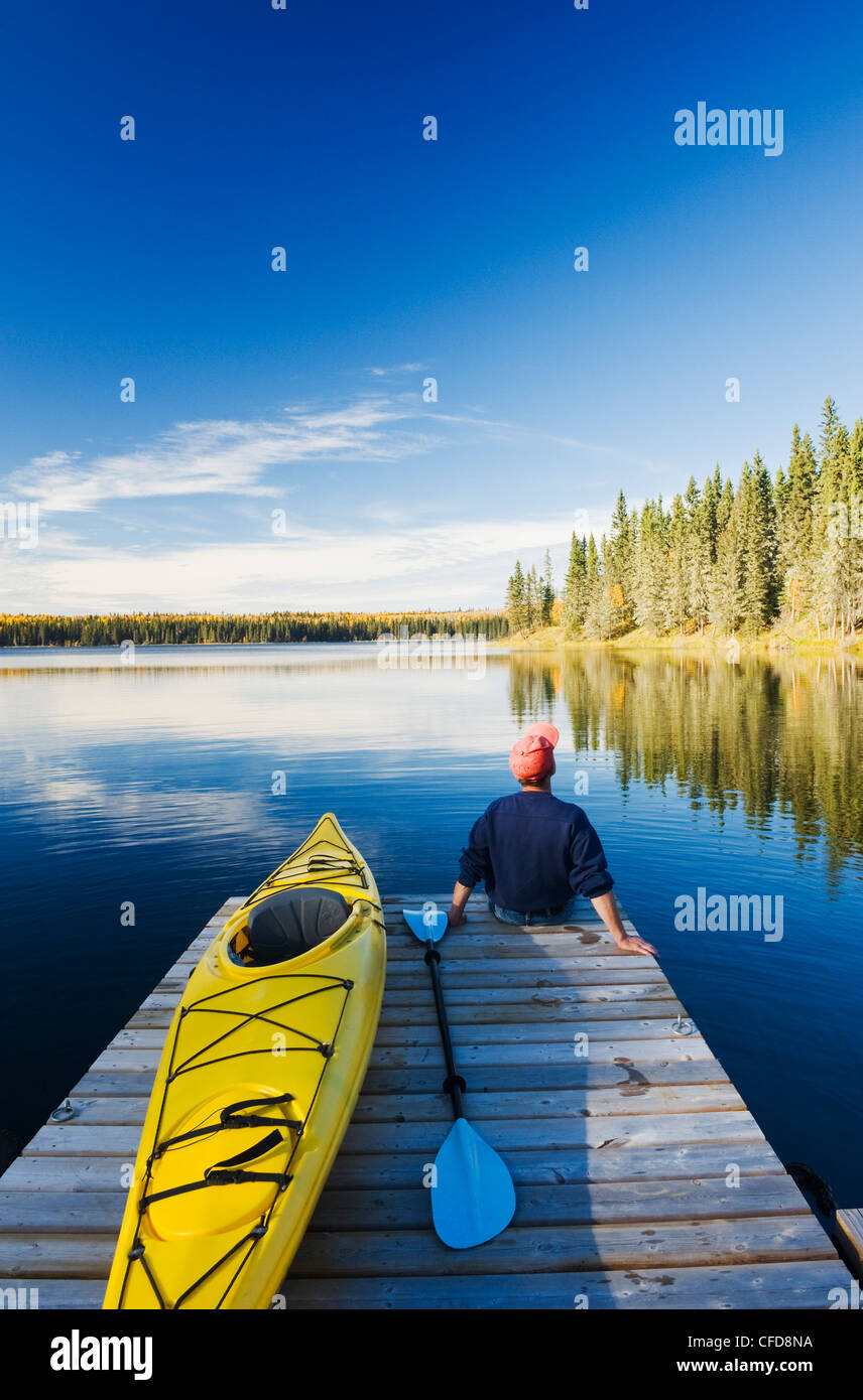 Kayaker on dock, Hanging Heart Lakes, Prince Albert National Park