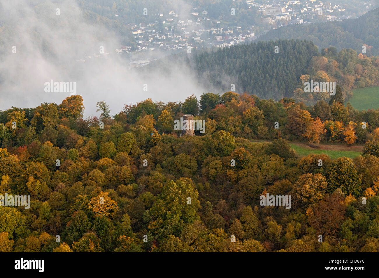 Aerial view of Dronke tower amidst autumnal trees and rising fog, rural district of Rhineland Palatinate, Germany, Europe Stock Photo