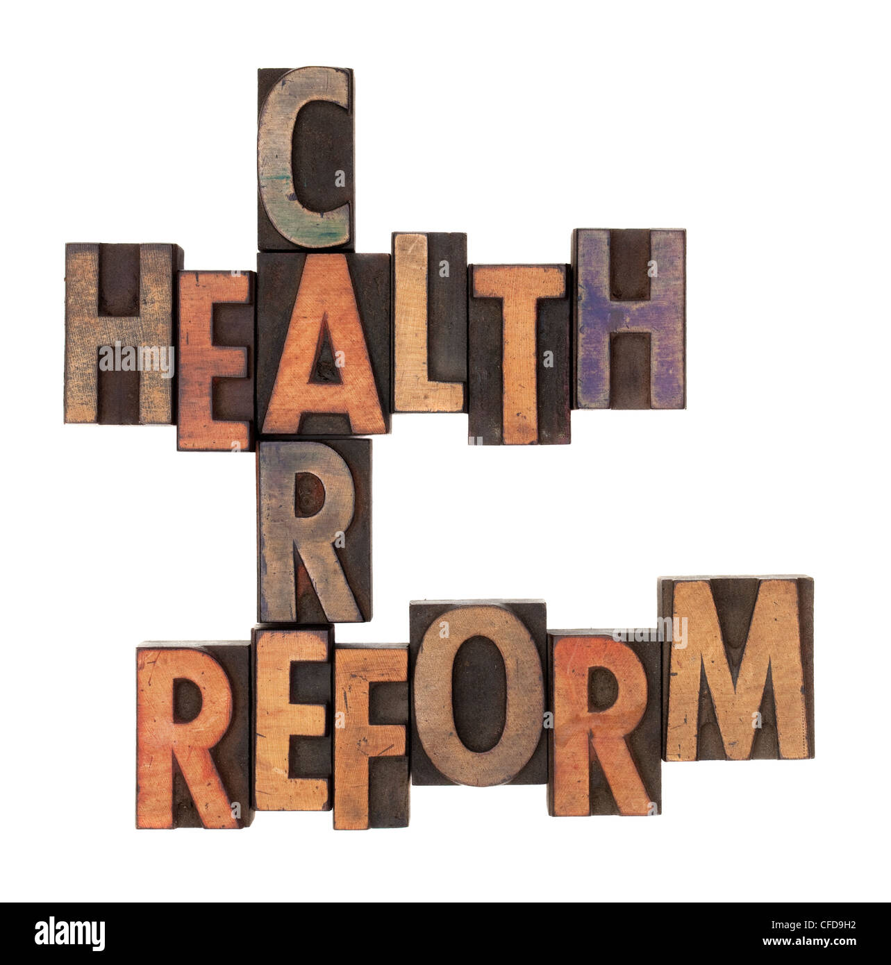 health care reform crossword in vintage wooden letterpress types stained in ink, isolated on white Stock Photo