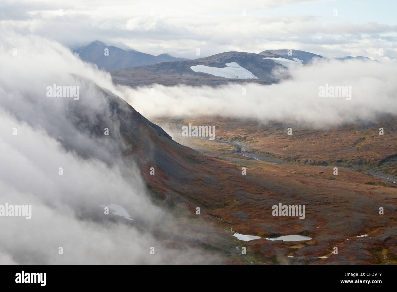 Clouds and mountains and tundra in the fall, Katmai Peninsula, Alaska, United States of America, Stock Photo