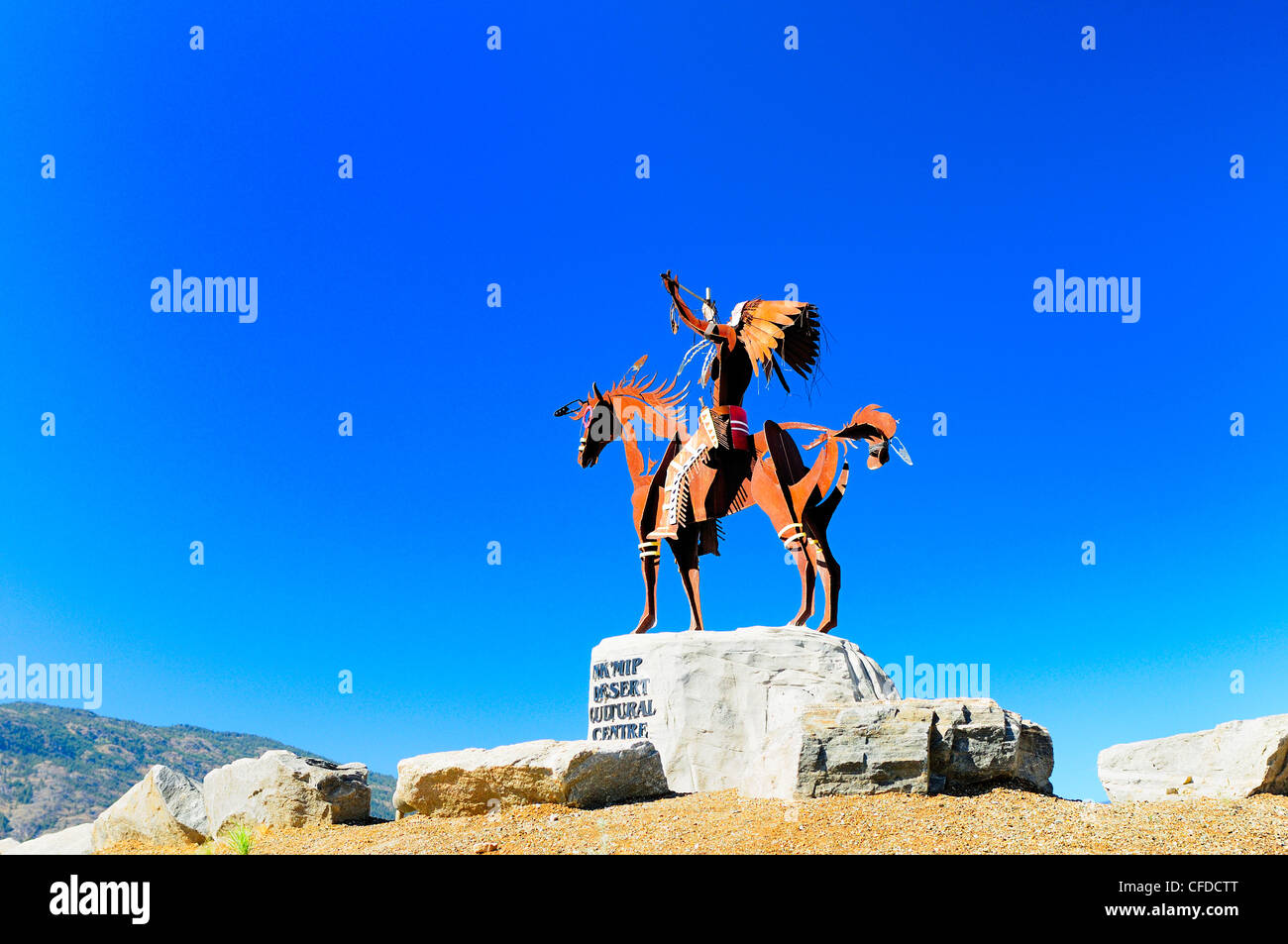 A statue of a native Indian with head dress, on a horse at Nk'Mip Desert Cultural Centre, Osoyoos, British Columbia, Canada Stock Photo