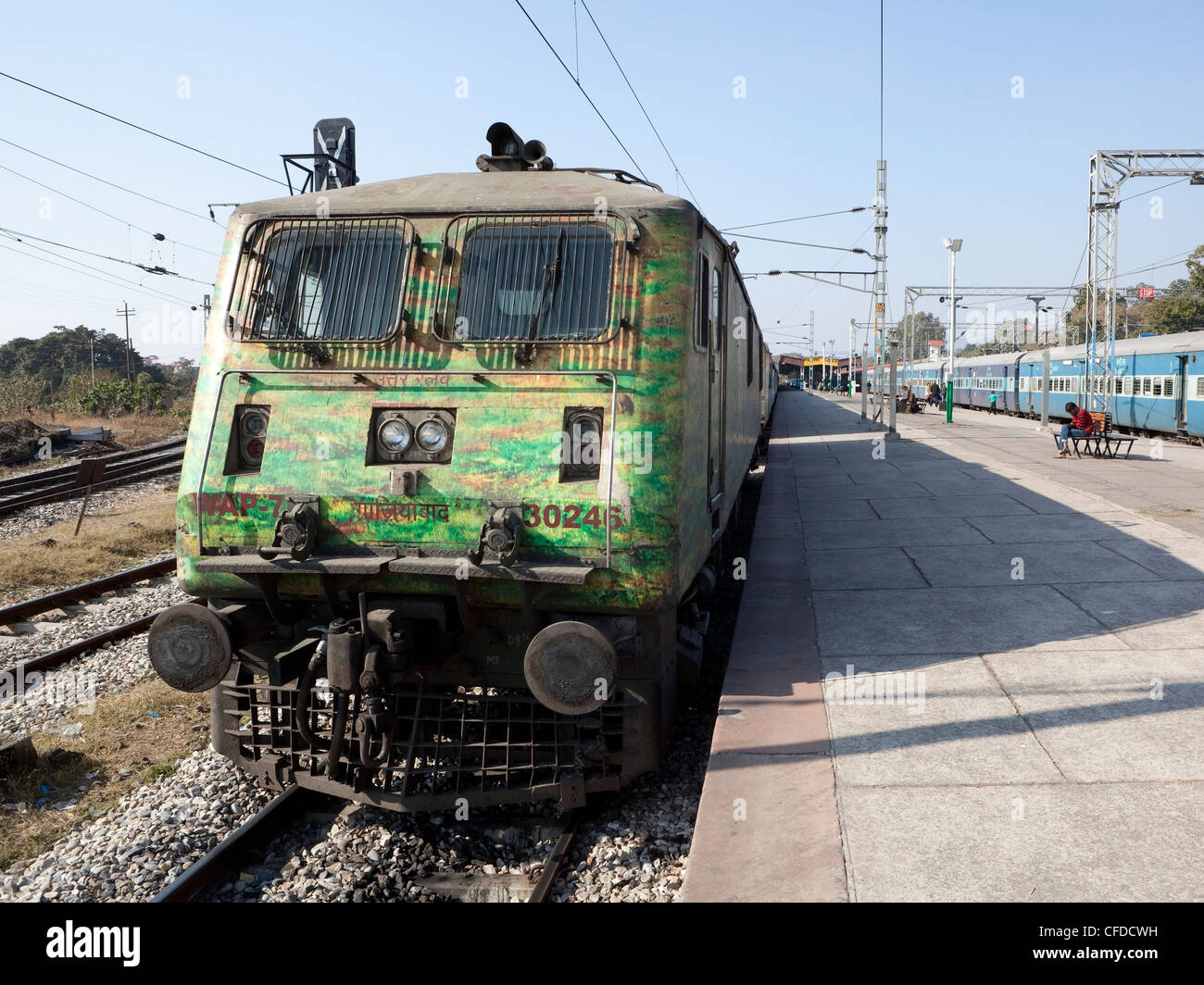an Indian train waiting on the electrified track at Kalka railway station in the Indian state of Haryana. Stock Photo