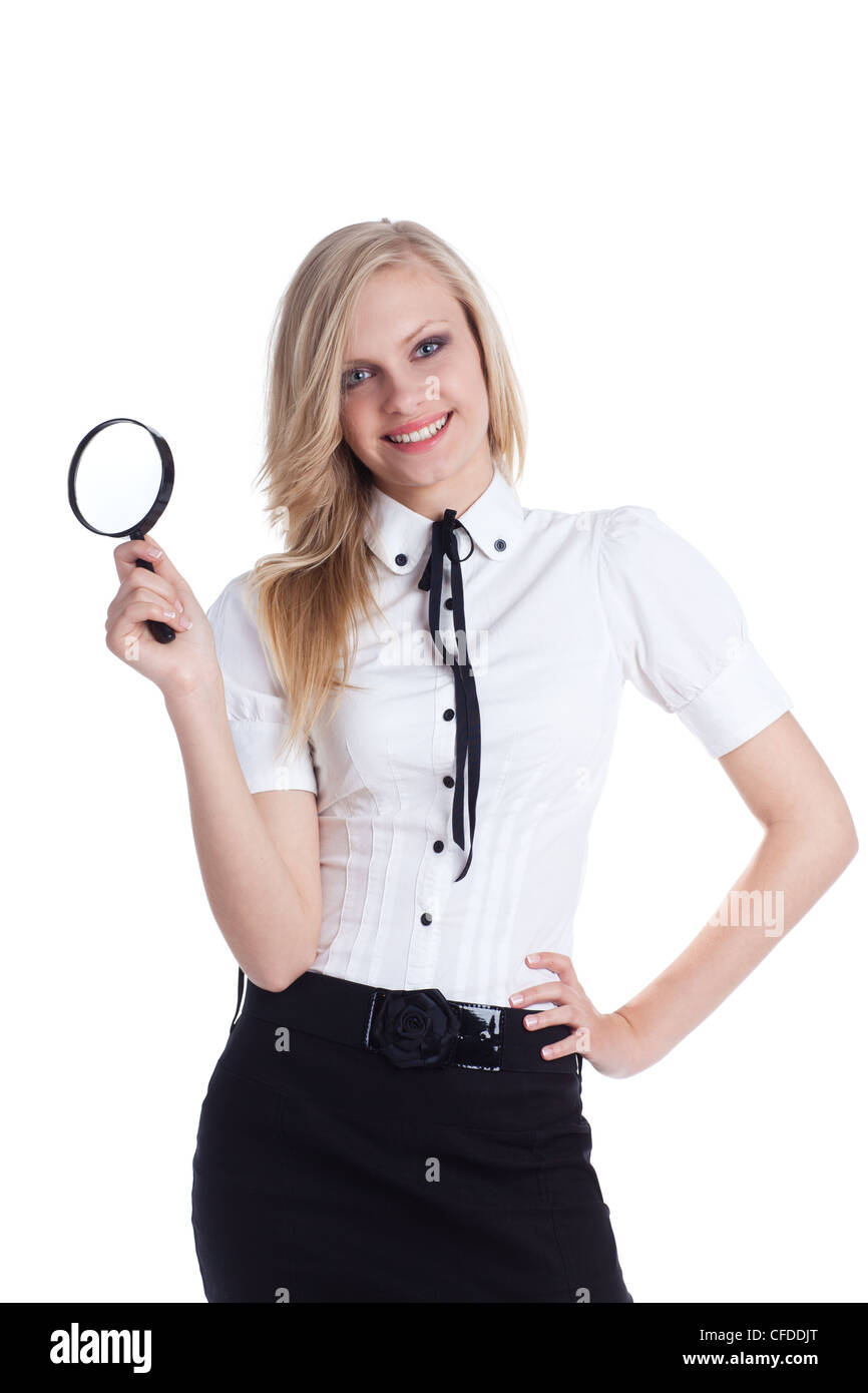 Woman looking through a magnifying glass Stock Photo - Alamy