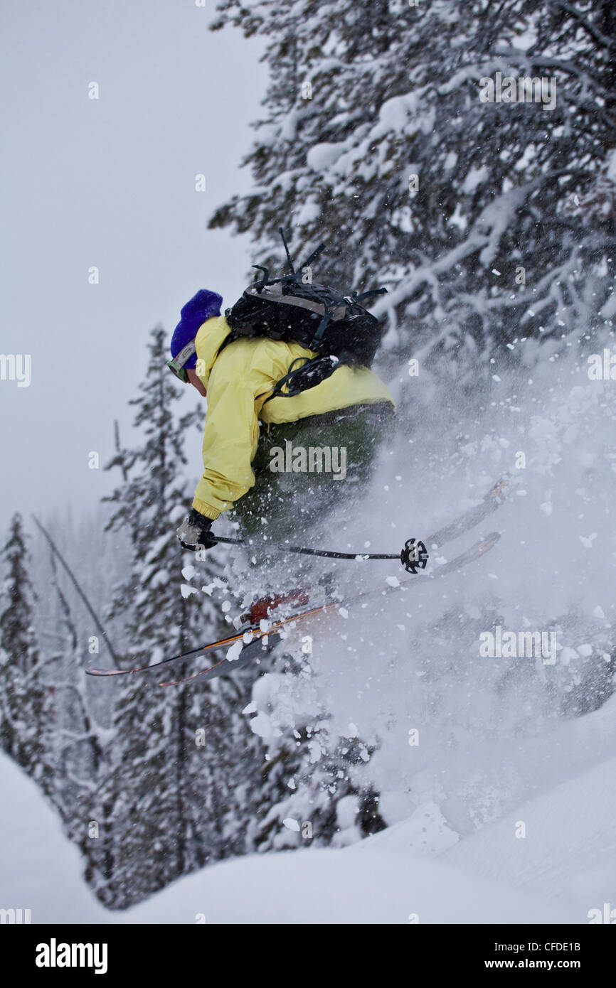 A male skier catches some air off a snow pillow. Kicking Horse