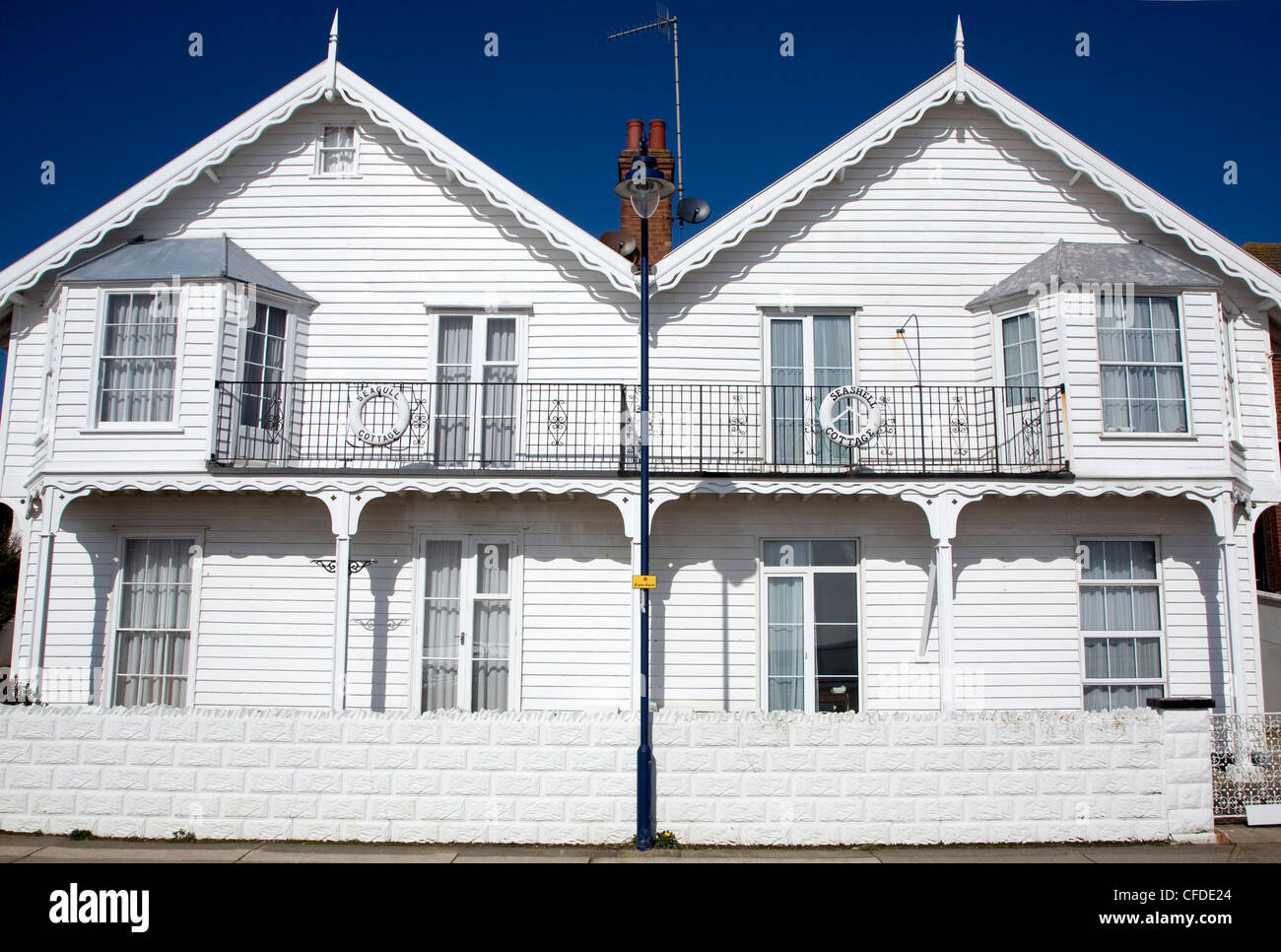 Semi detached wooden weatherboarded white seaside houses, Undercliff