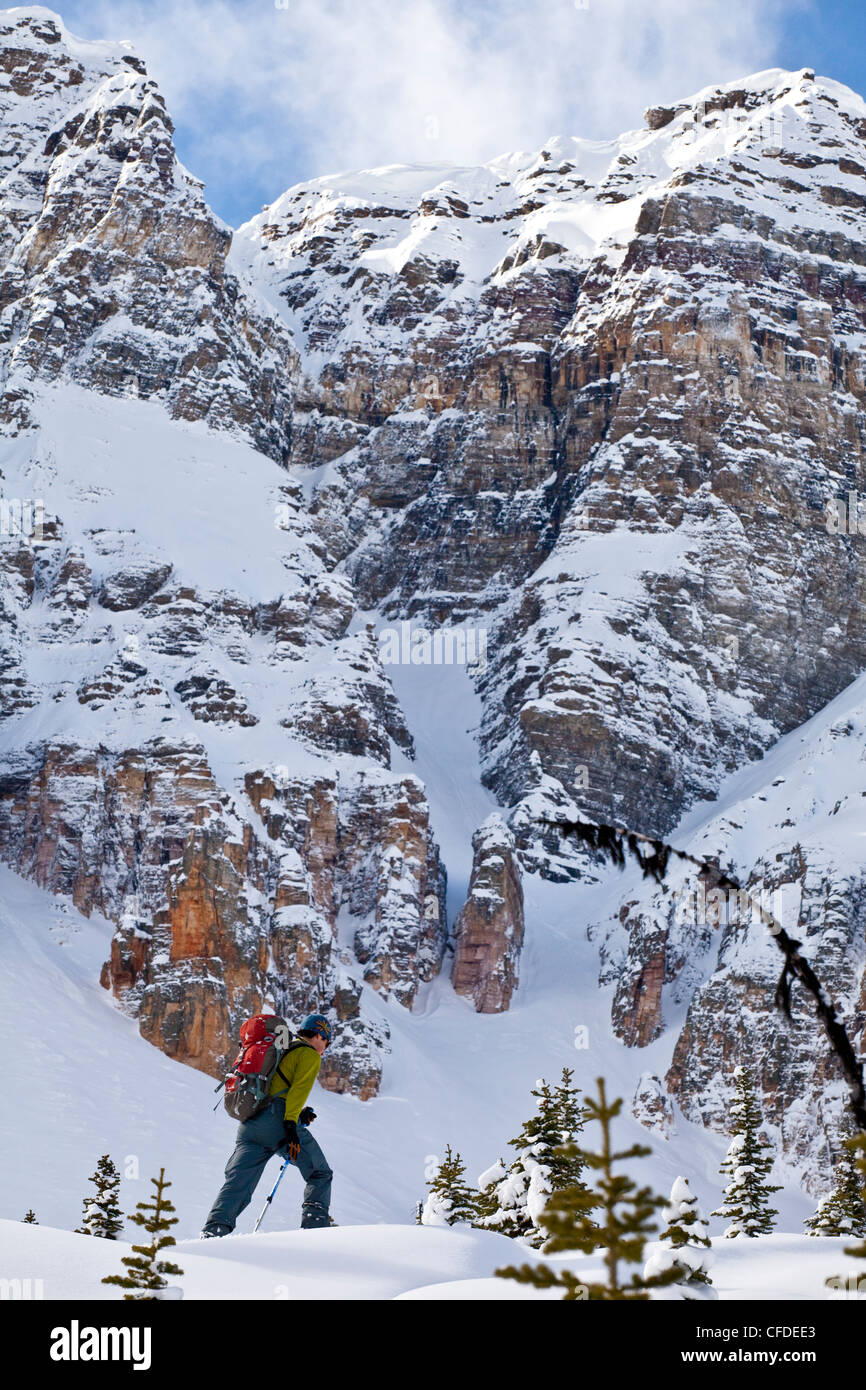 A male telemark skier skins his way up into the alpine, Icefields