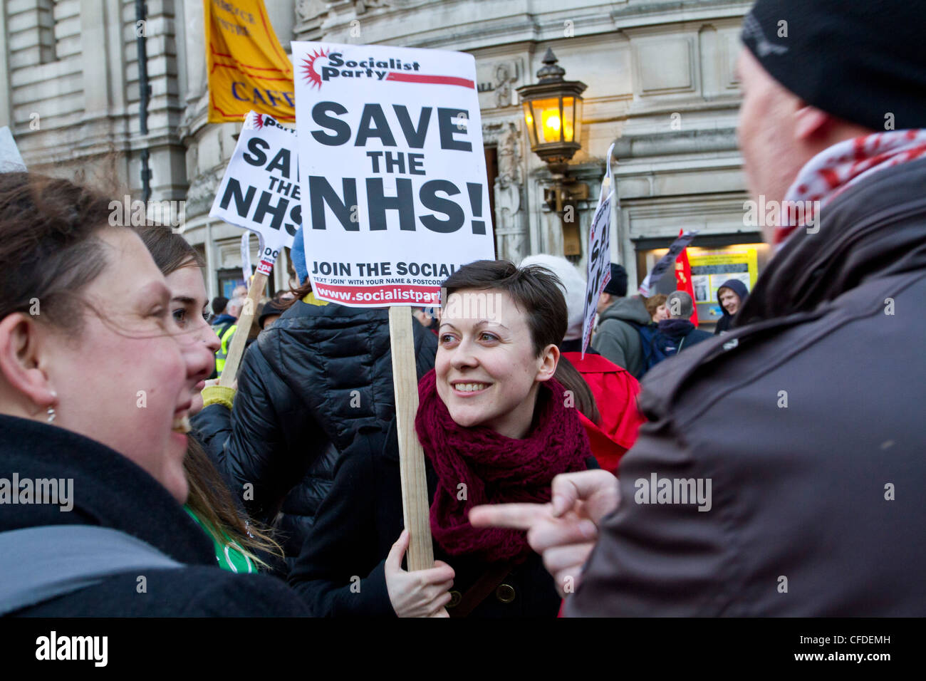 London, UK 7th March 2012. Save our NHS, A NHS protester seen here with a placard saying 'Save the NHS'. Stock Photo