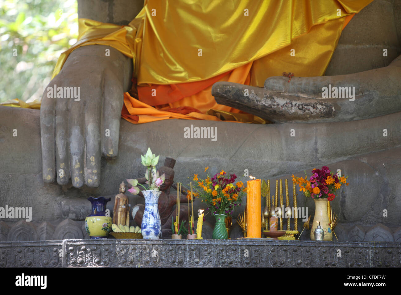 Buddha statue in earth-touching pose, with offerings, Siem Reap, Cambodia, Indochina, Southeast Asia, Asia Stock Photo