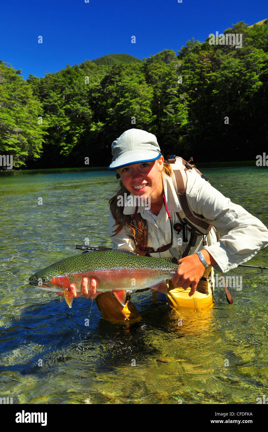 Woman holding rainbow trout, New Zealand Stock Photo Alamy