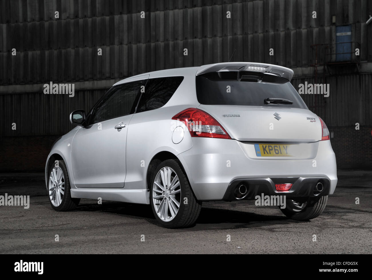 2012 model Suzuki Swift Sport hot hatch sports car rear 3/4 three quarter view Stock Photo Alamy