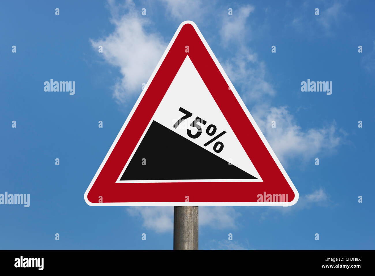 Detail photo of a danger sign 'Steep hill downwards' with the inscription 75 percentage, background sky. Stock Photo