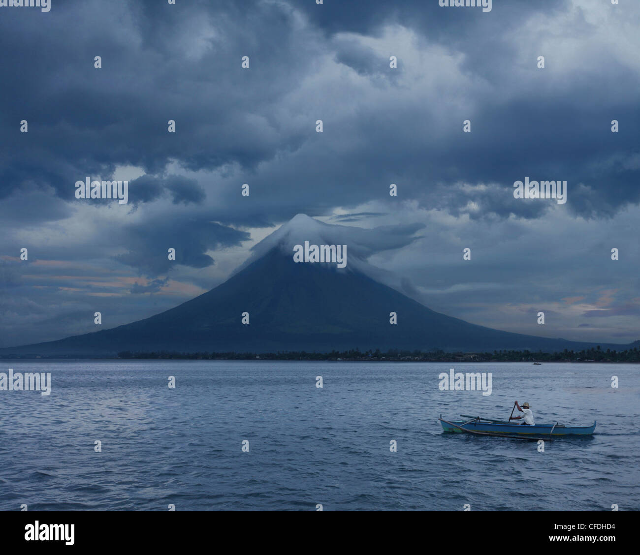 Fisherman with Mayon Volcano, Legazpi City, Luzon Island, Philippines, Asia Stock Photo