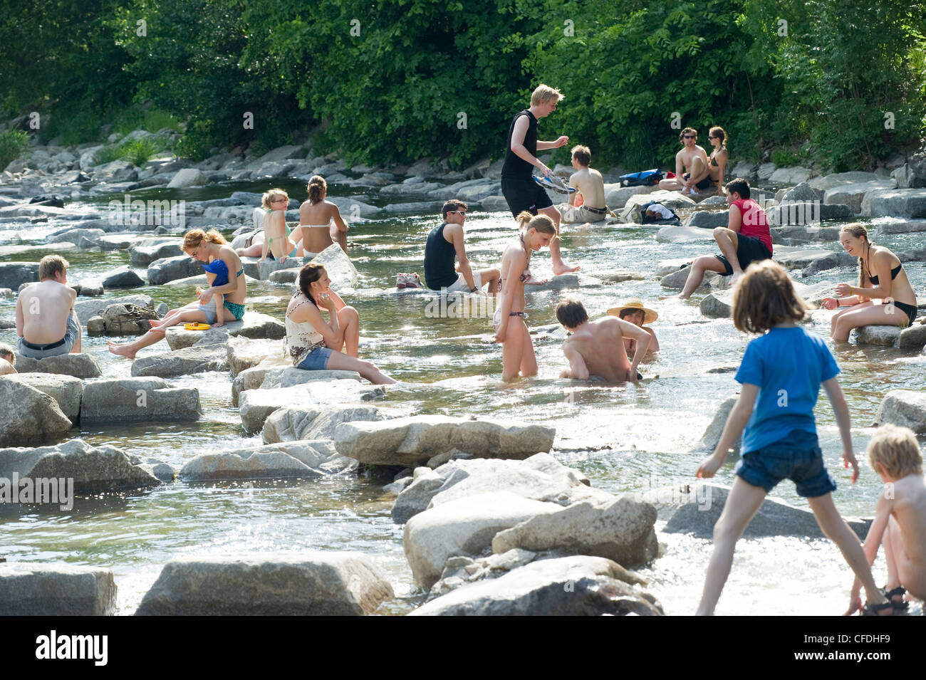 People relaxing at river Dreisam, Freiburg im Breisgau, Baden-Wurttemberg, Germany Stock Photo