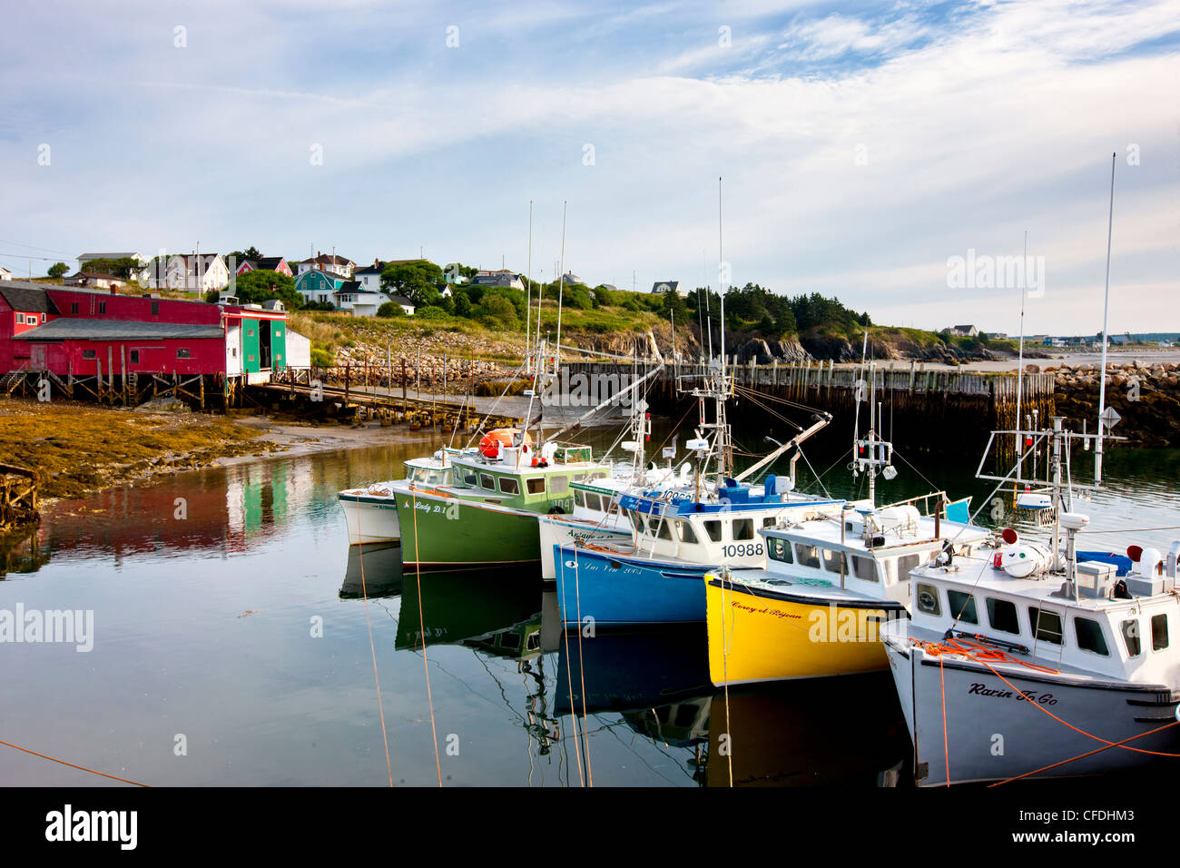 Fishing boats tied up at wharf, Cape St. Mary's, Nova Scotia, Canada Stock Photo