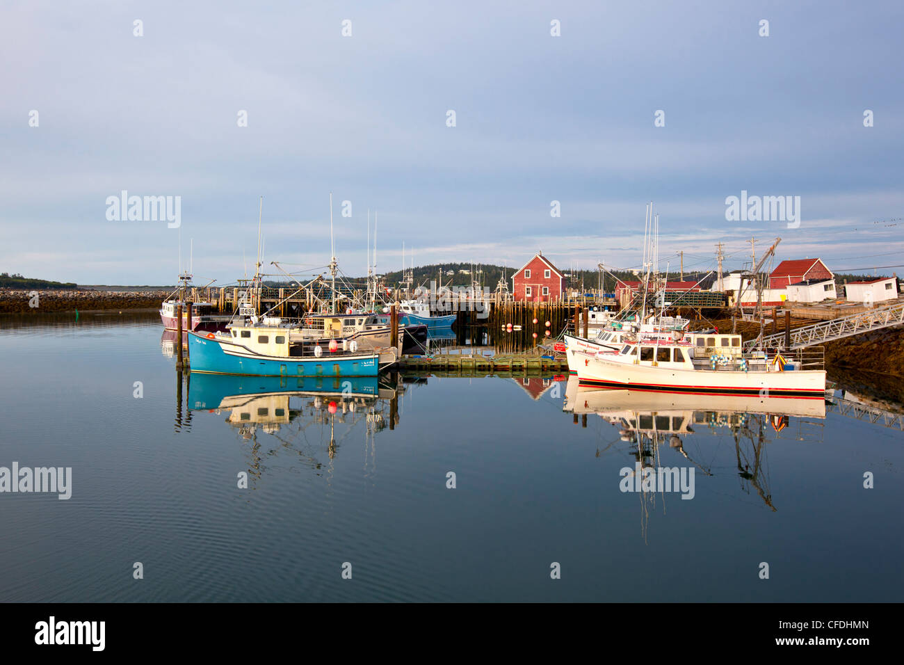 Fishing boats tied up at wharf, Yarmouth Bar at dawn, Nova Scotia, Canada Stock Photo