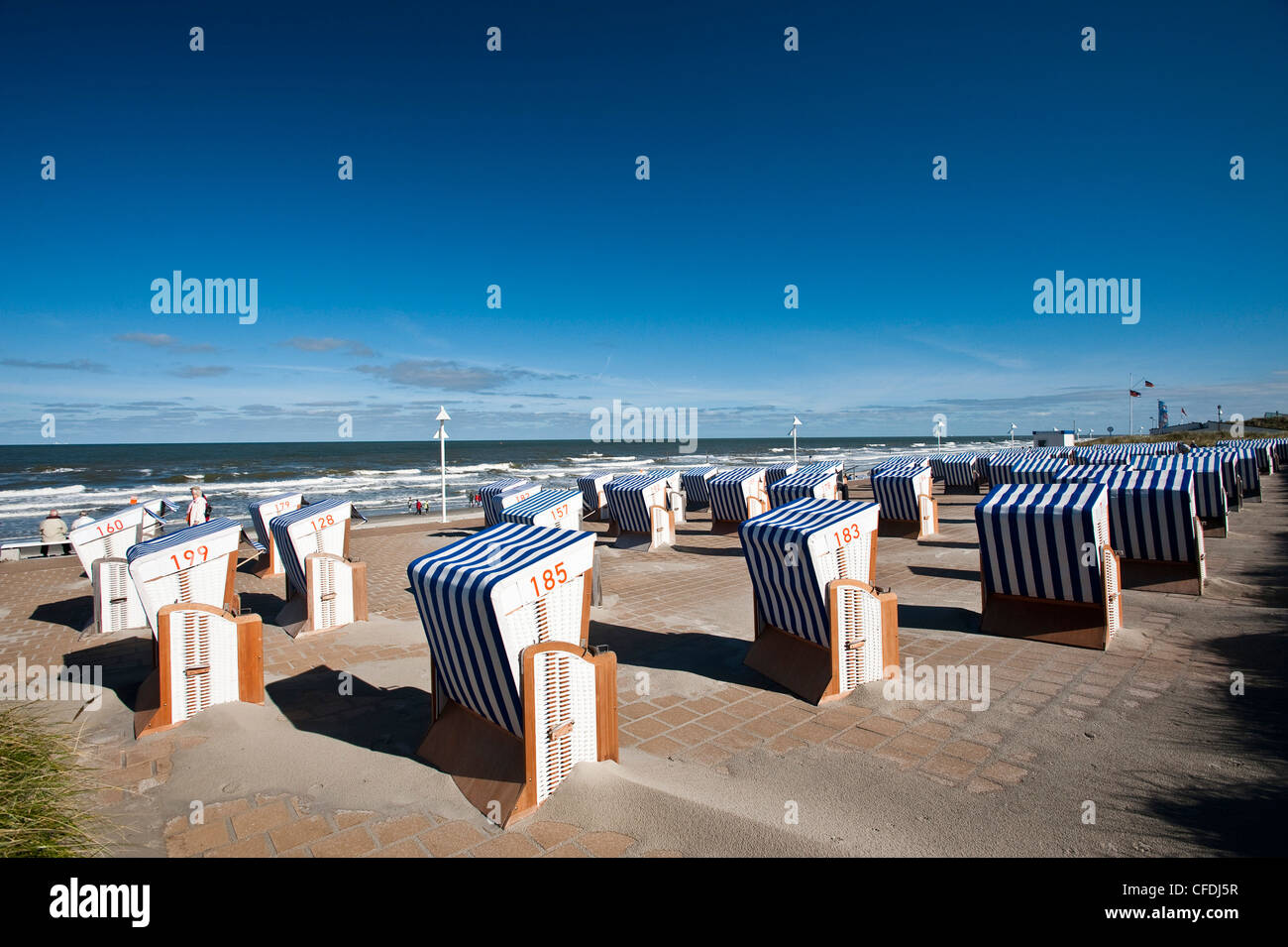Roofed wicker beach chairs at promenade, Norderney, East Frisian Islands, Lower Saxony, Germany Stock Photo