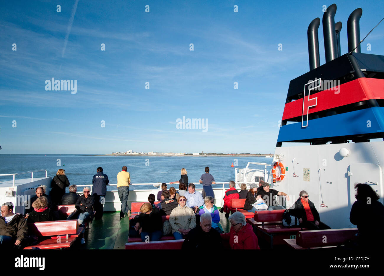 Passengers on ferry to Norderney island, East Frisian Islands, Lower Saxony, Germany Stock Photo