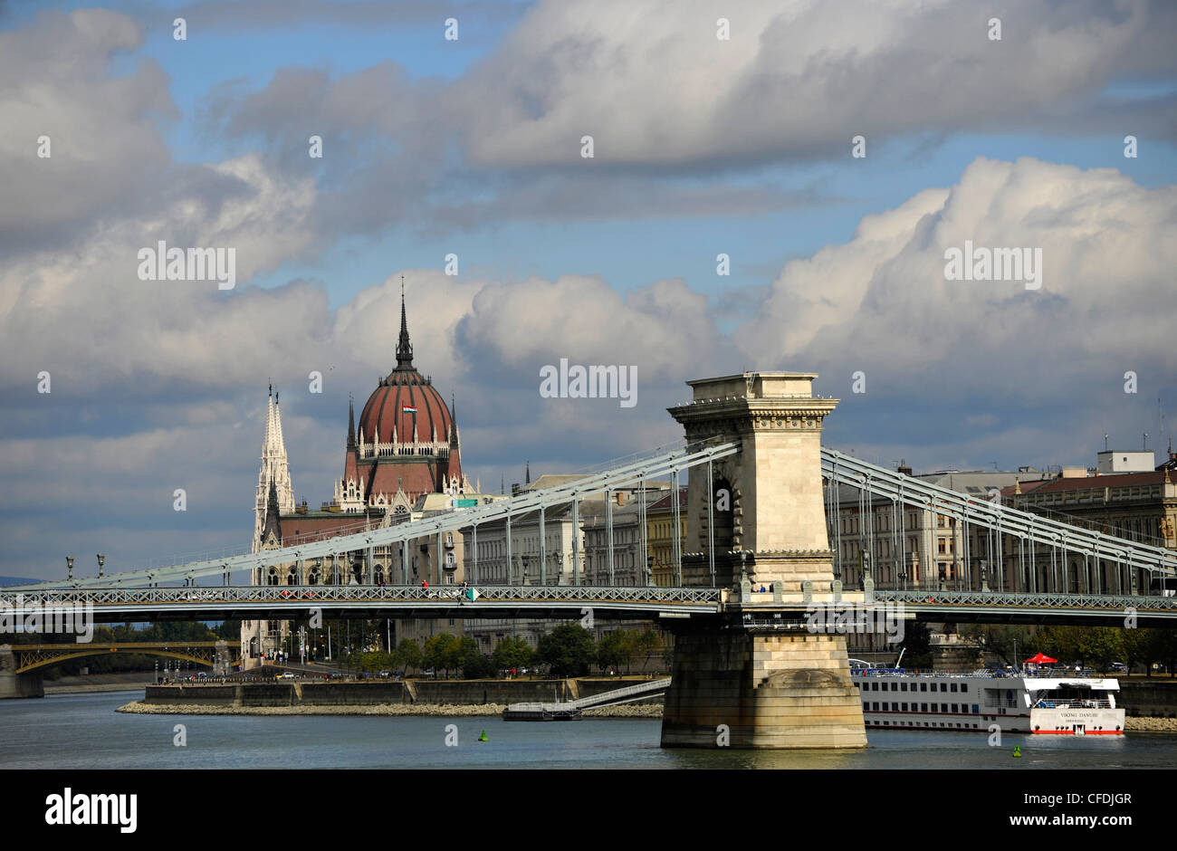 Danube river, House of Parliament and Chain Bridge under clouded sky, Budapest, Hungary, Europe Stock Photo