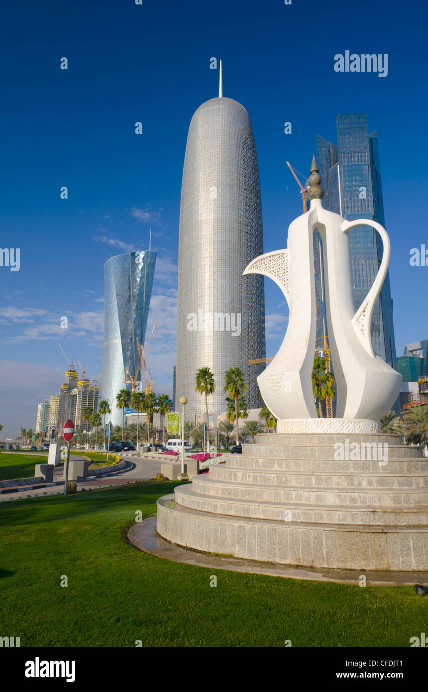 Corniche, Coffee Pot sculpture with Al Bidda Tower, Burj Qatar and Palm Tower behind, Doha, Qatar, Middle East Stock Photo