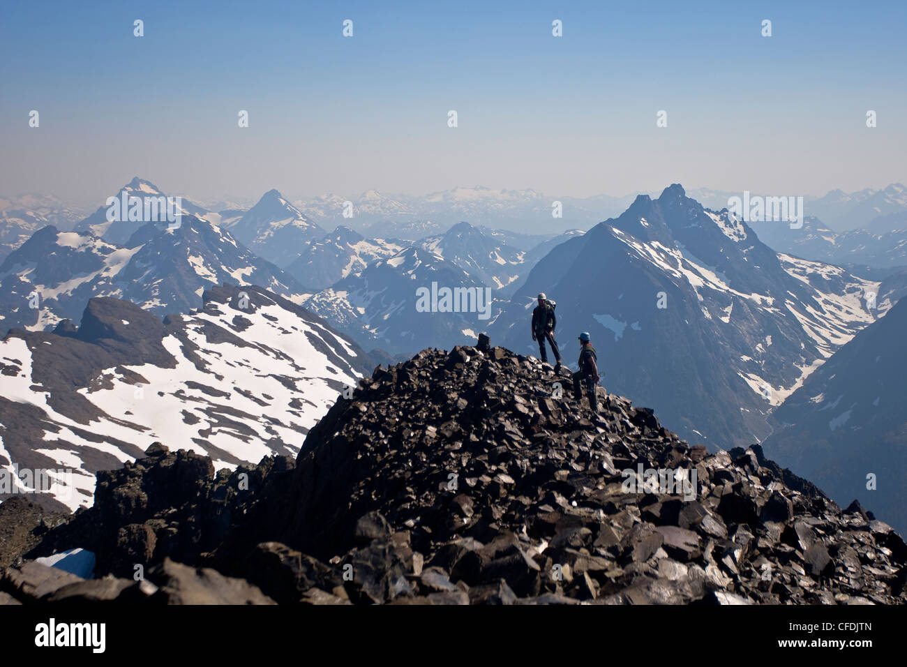 Two climbers summit Elkhorn Mountain, Strathcona Park, Central Vancouver Island, British