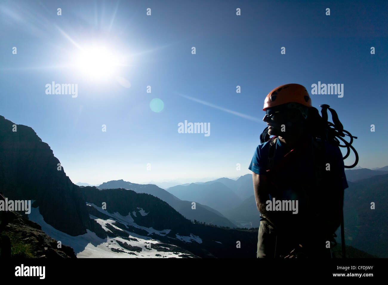 backlit climber surveys terrain around Elkhorn Stock Photo