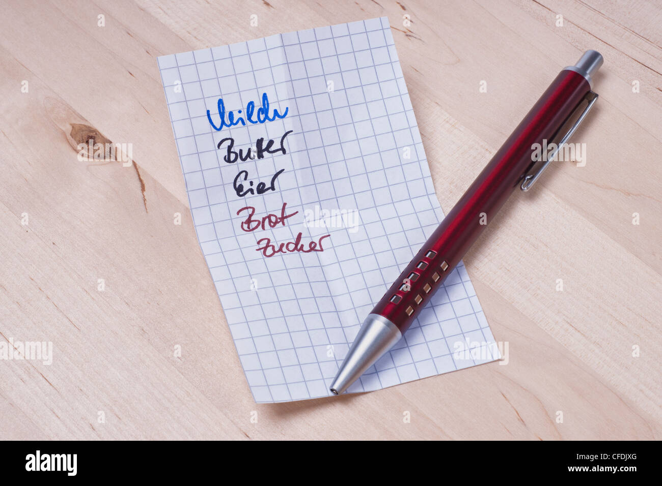Detail photo of a Shopping list in German language with milk butter eggs bread sugar Stock Photo