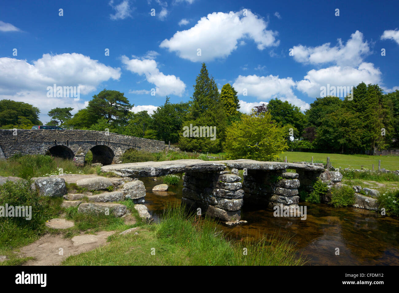 Medieval clapper bridge crossing the East Dart River, Postbridge, Dartmoor, Devon, England, UK Stock Photo