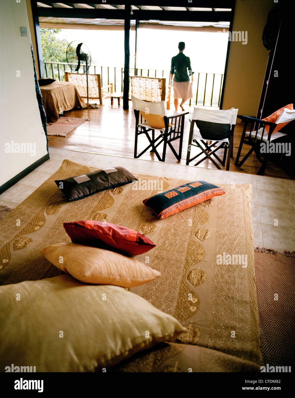 Woman in Superior Room Chalet, Mango Lodge, view over Anse Volbert, Bahia Ste. Anne, Praslin, Republic of Seychelles, Indian Oce Stock Photo