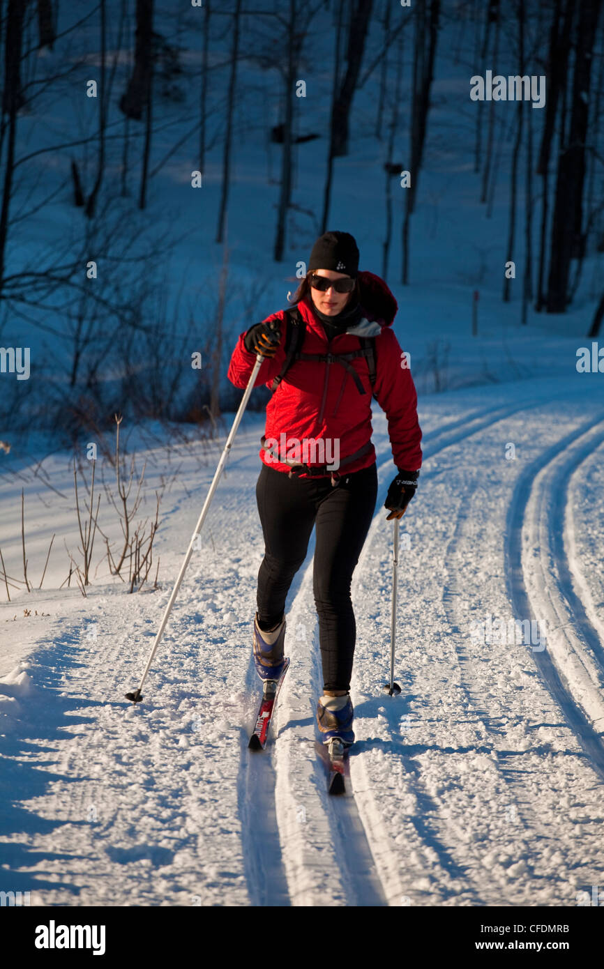 A woman crosscountry skiing at Mt Orford, Quebec, Canada Stock Photo
