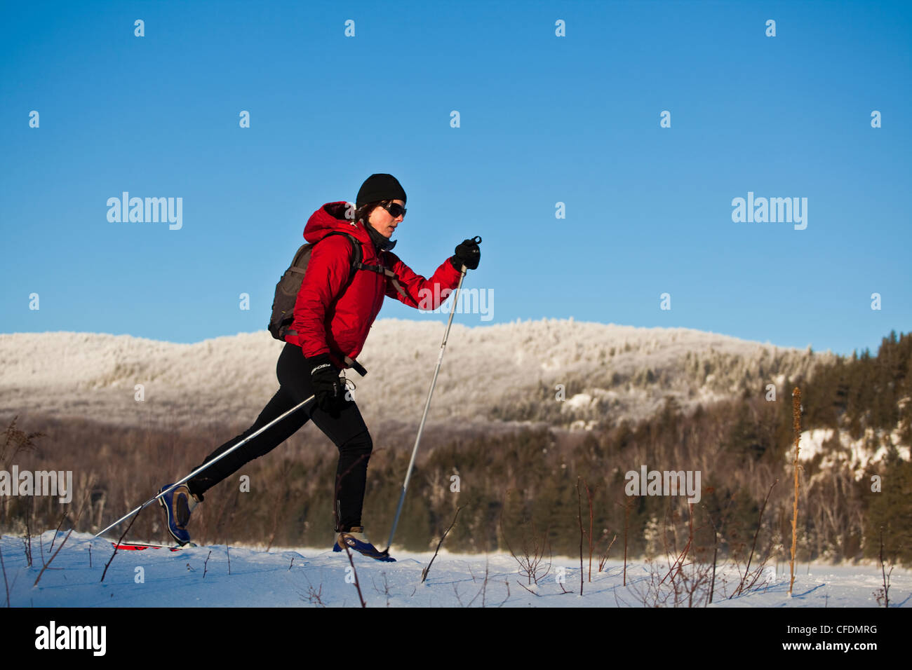 A woman crosscountry skiing at Mt Orford, Quebec, Canada Stock Photo