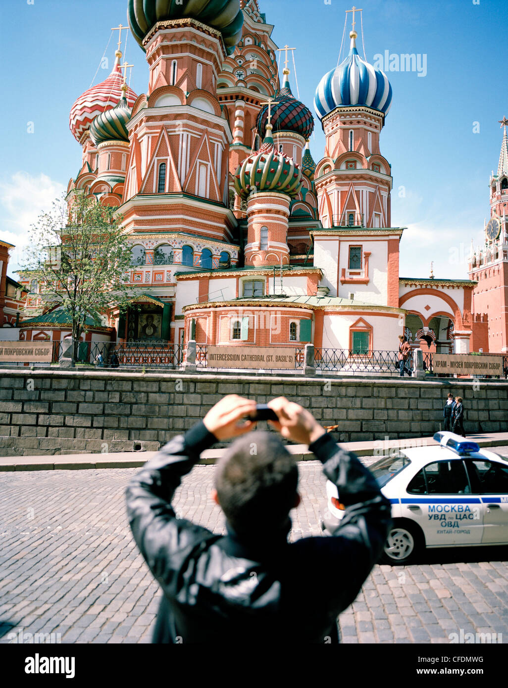 Tourist taking pictures of St. Basil's Cathedral with his cell phone, Moscow, Russia, Europe Stock Photo