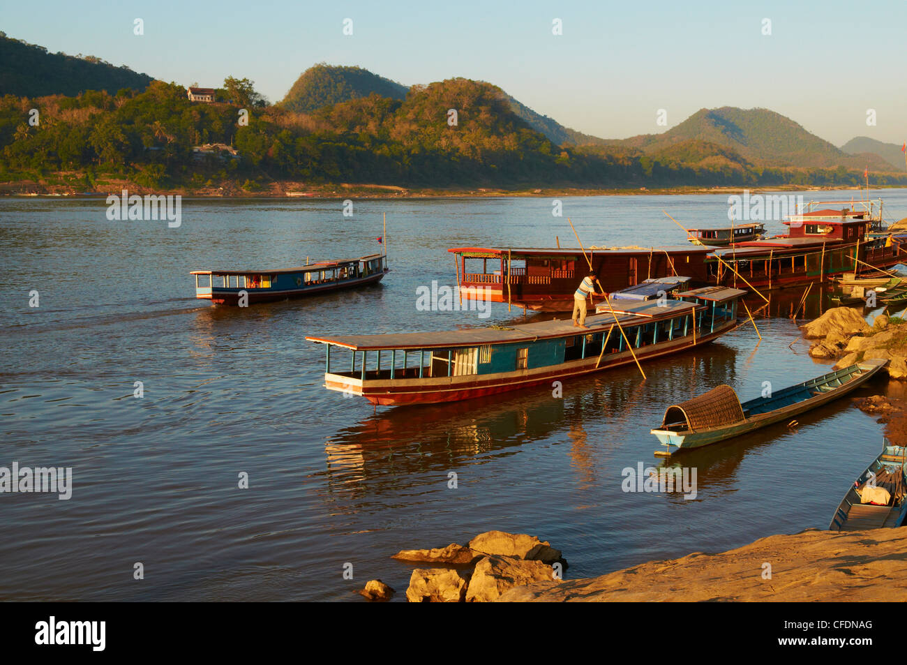 Tourist boats at sunset on the Mekong River, Luang Prabang, Laos, Indochina, Southeast Asia, Asia Stock Photo