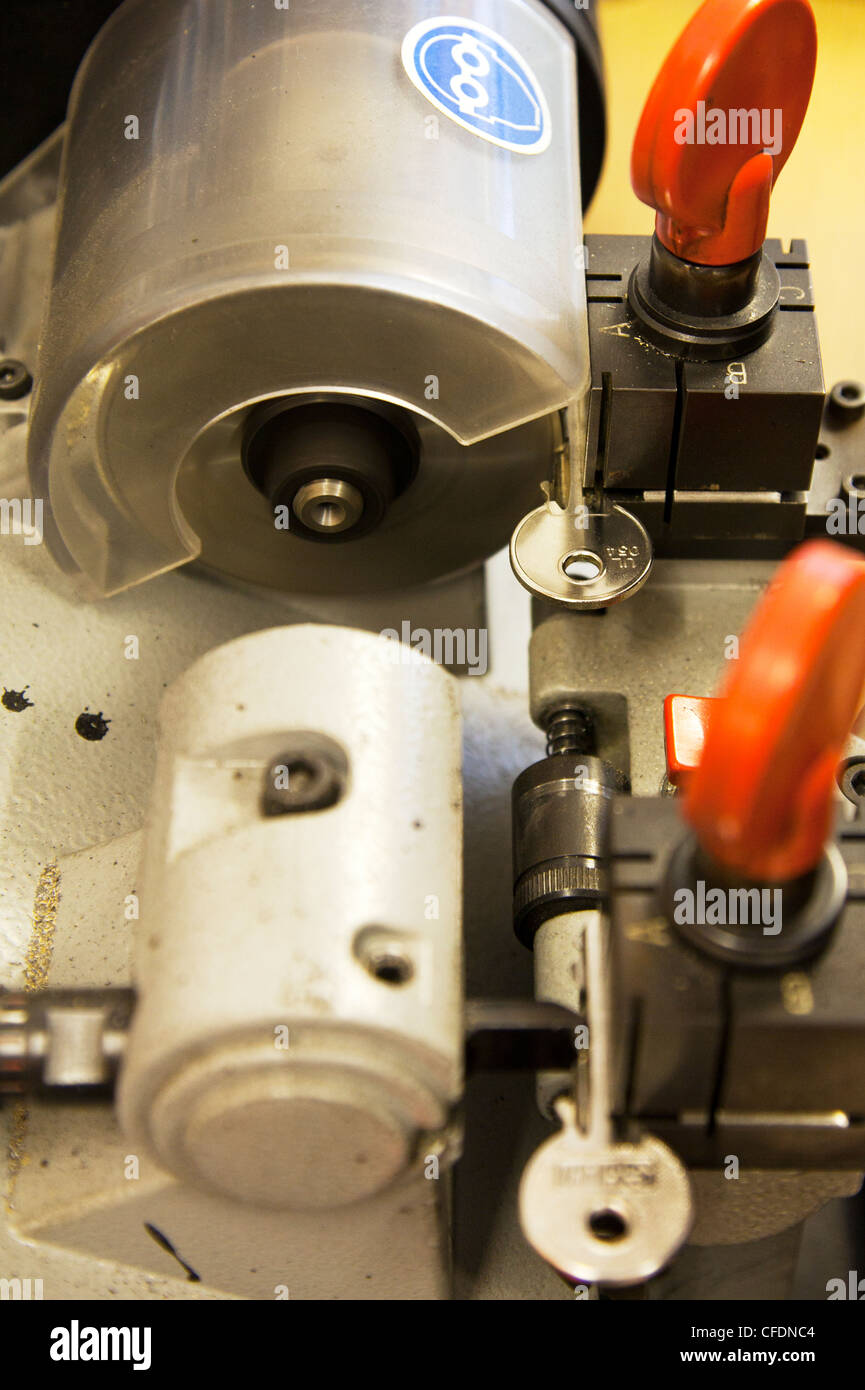 Cylinder yale type key cutting machine being used to copy keys by