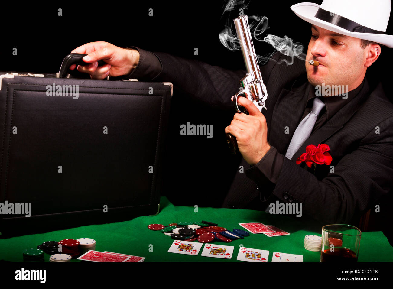 View of a white suit gangster man holding a gun and a briefcase Stock ...