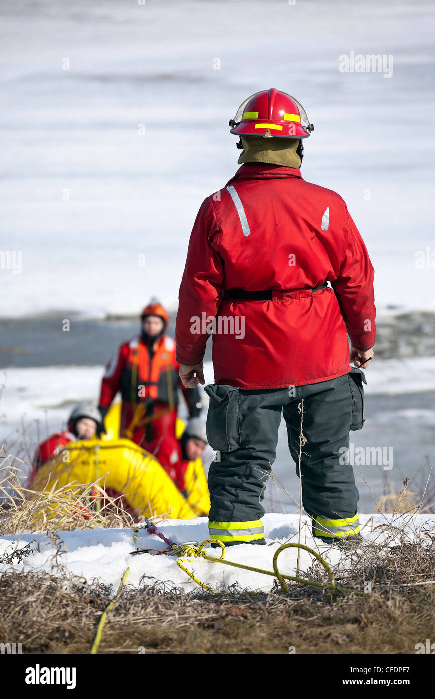 Water search and rescue workers on the Assiniboine River. Winnipeg, Manitoba, Canada. Stock Photo