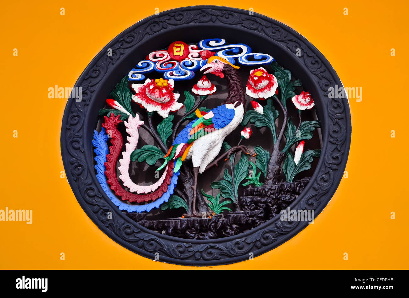 chinese ornament depicting a colorful peacock and flowers Stock Photo