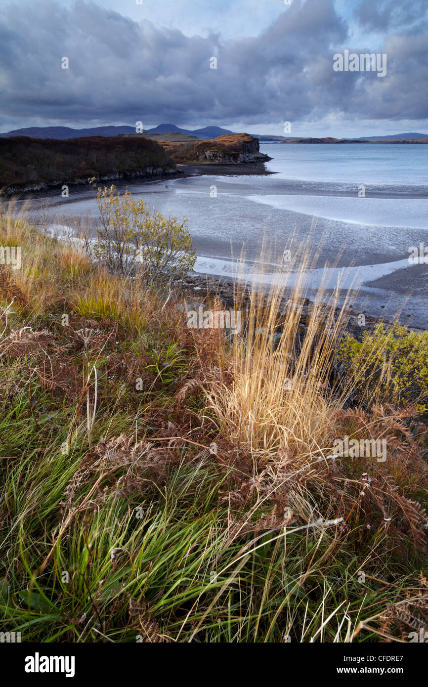 The view from Fiskavaig Bay across Loch Bracadale with the distinctive mountains MacLeod's tables in the distance, Scotland, UK Stock Photo
