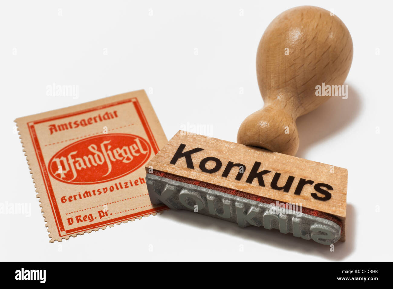 Detail photo of three bailiff's seals for distraint of goods, of approx. 1960, alongside is a stamp with the label insolvency Stock Photo