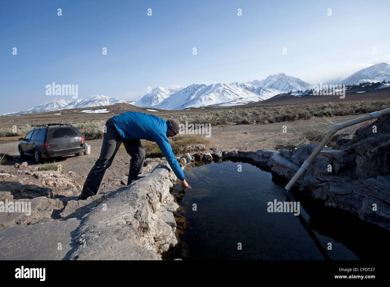 A man hot springing near the mountains. Stock Photo