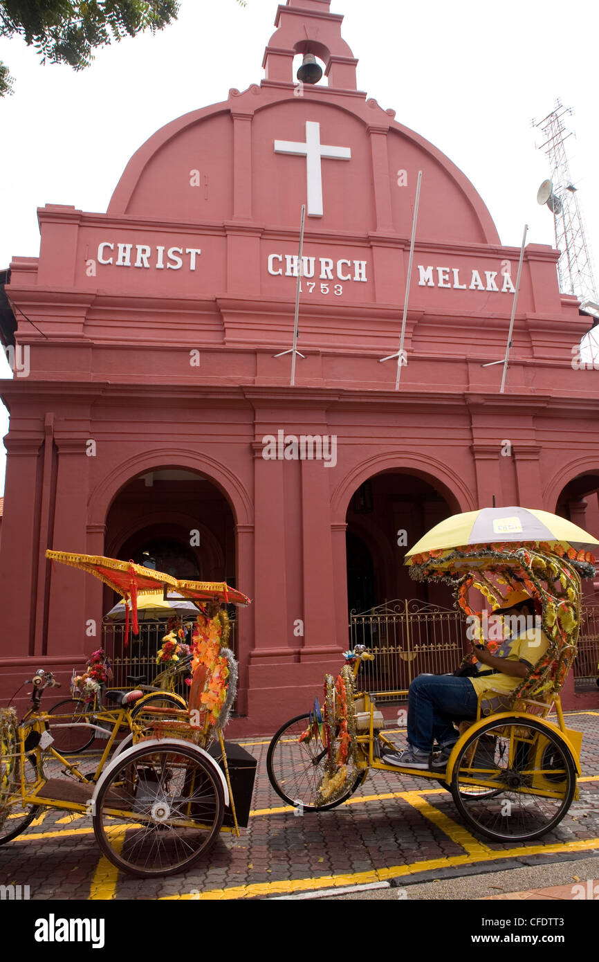 Christ Church and trishaws, Malacca (Melaka), Malaysia, Southeast Asia, Asia Stock Photo
