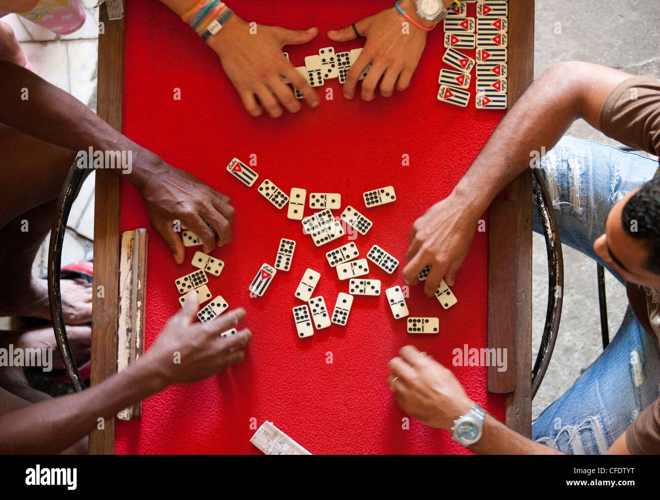 Overhead view of four people playing dominos, Havana, Cuba, West Indies Stock Photo