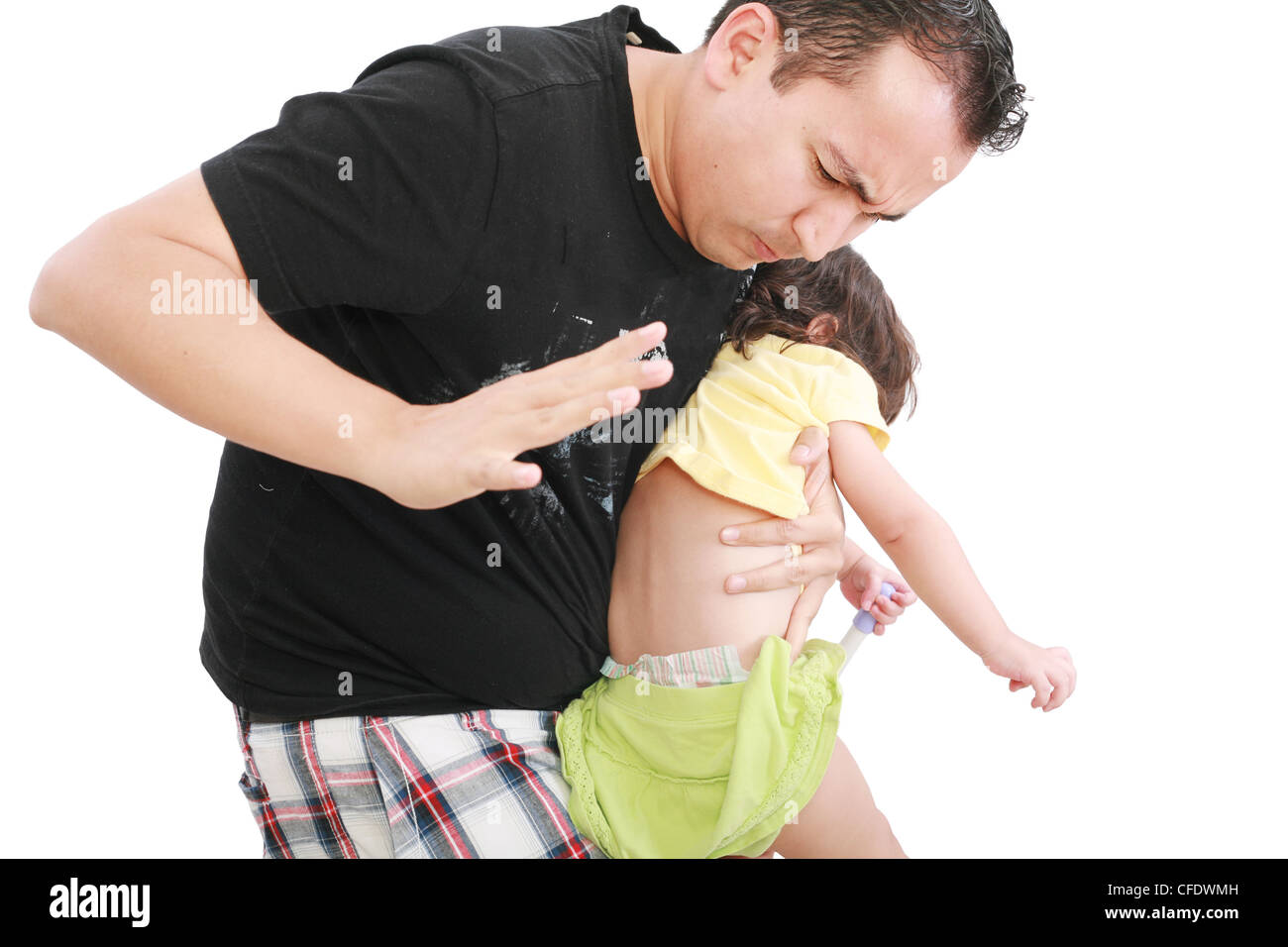 Angry father hitting her little baby daughter Stock Photo