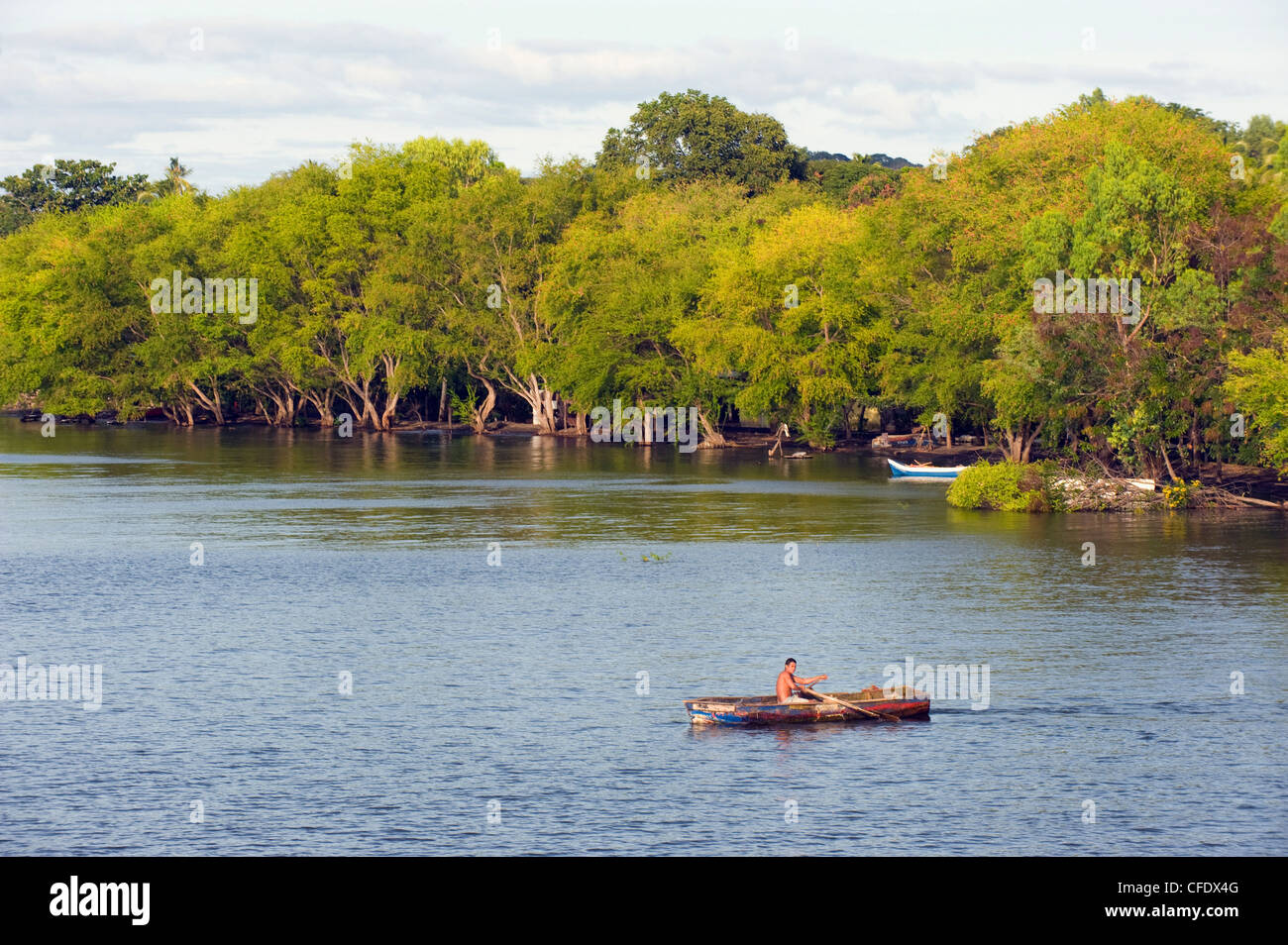 Man rowing a boat on Ometepe Island, Lake Nicaragua, Nicaragua, Central America Stock Photo