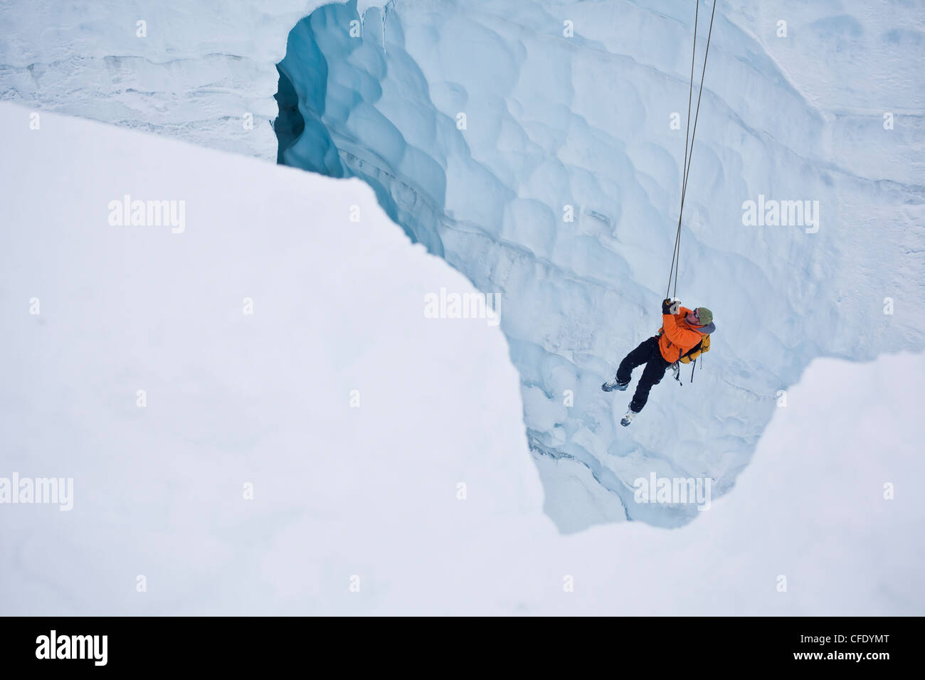 Two men practice crevasse rescue skills while on a ski mountaineering
