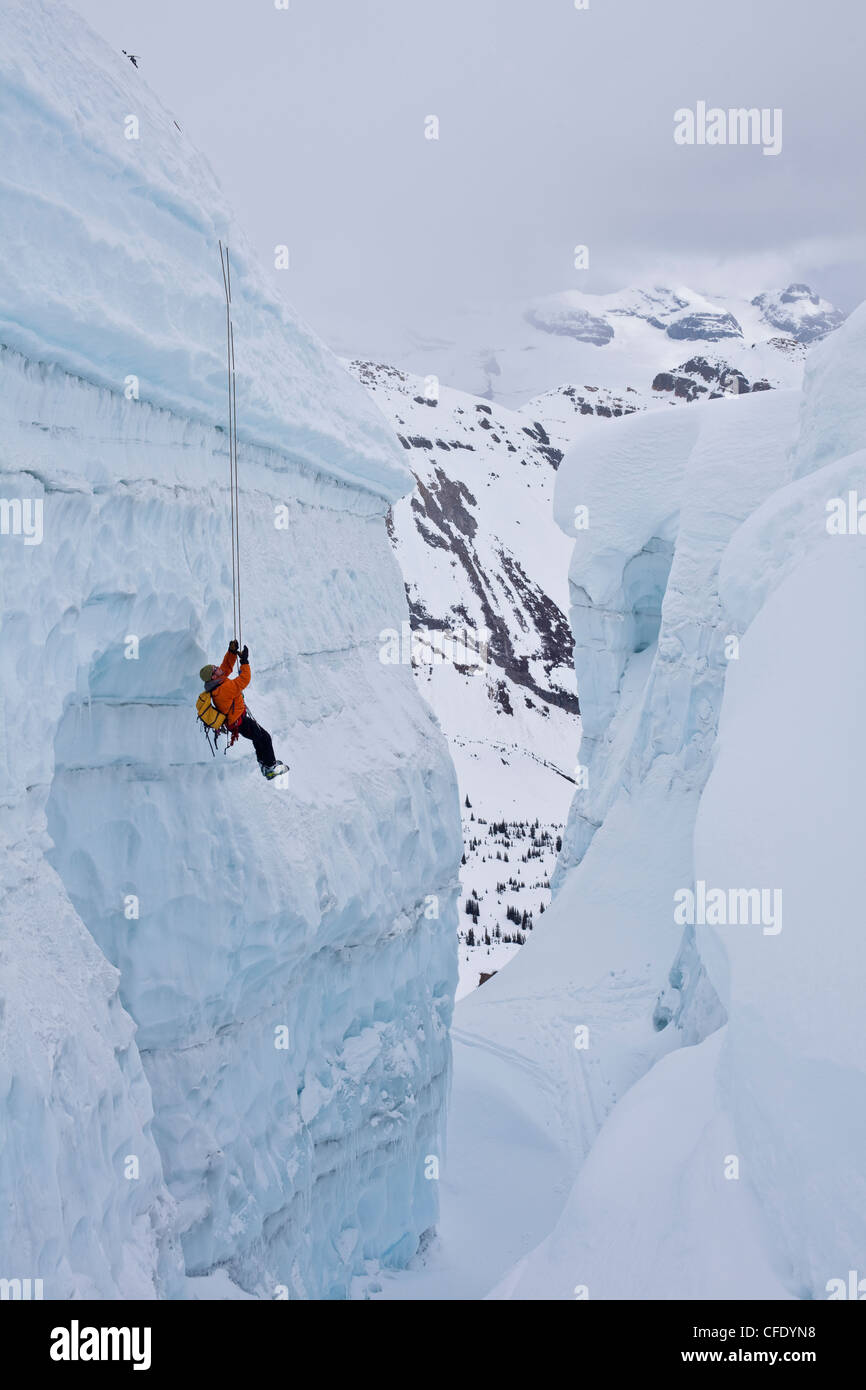 Man climbing ice fall hi-res stock photography and images - Alamy