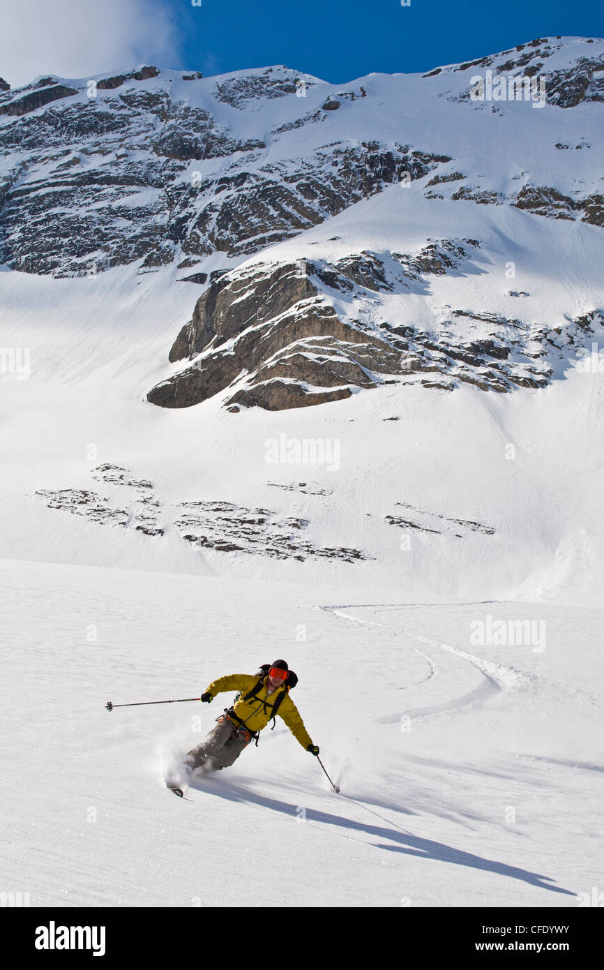A male backcountry tele skier finds fresh powder while on a hut trip at Icefall Lodge, Golden, British Columbia, Canada Stock Photo