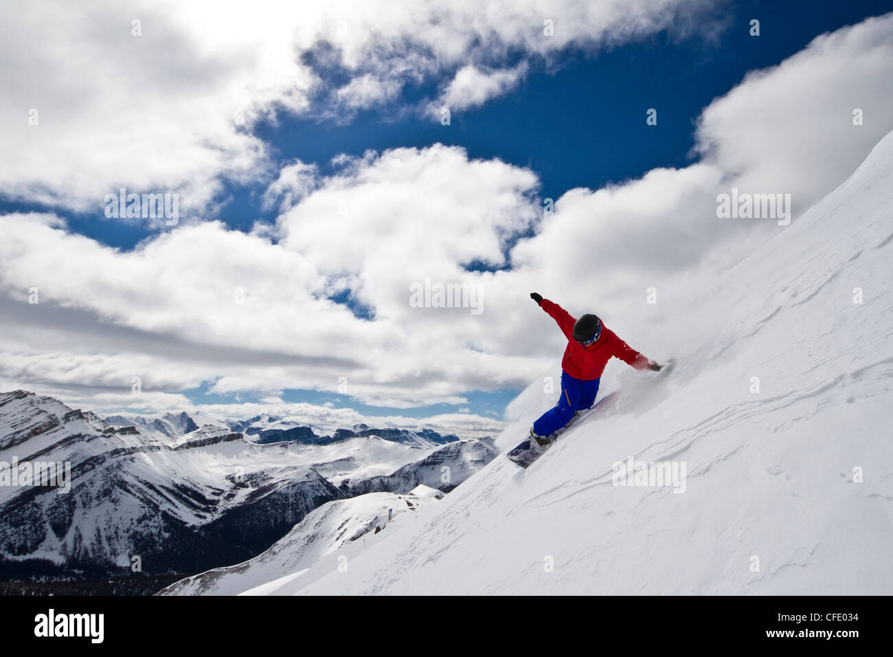 Young man snowboarding at Lake Louise Resort, Banff National Park